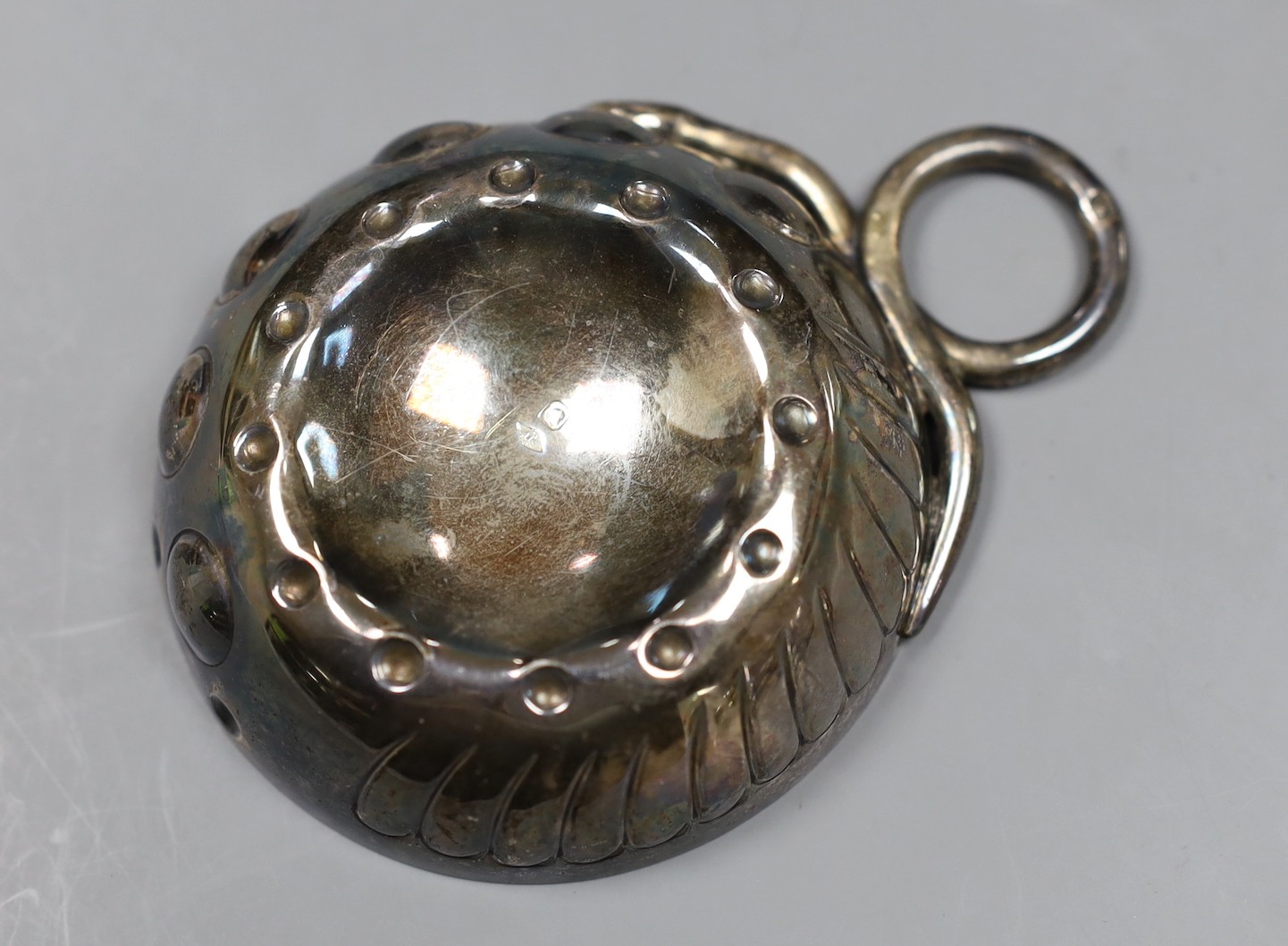 An early 20th century French white metal taste vin, 10cm over handle.